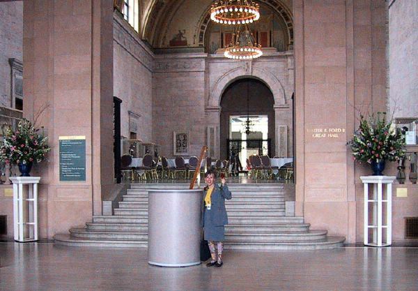 Wendy in Woodward Entrance DIA with floral arrangements in her honor 